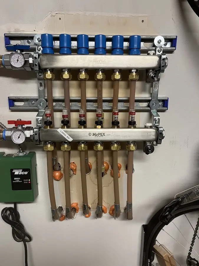 Plumber performing Gas Line Installation at a residential property in Norfolk